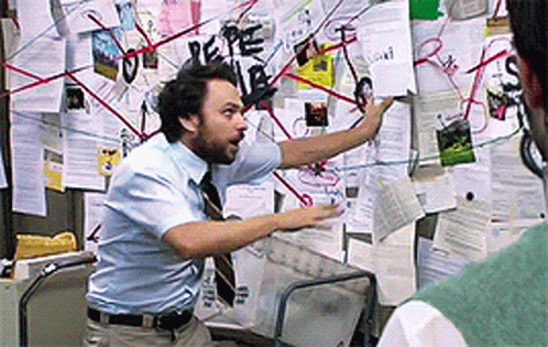 Charlie Kelly connecting notes on a board