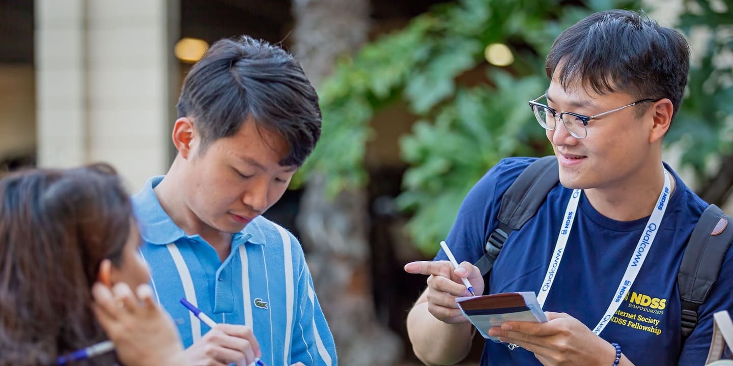 people talking and taking notes